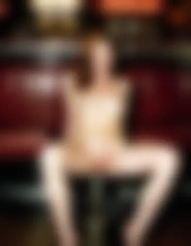 Evelyn, fingers tracing, dimly lit bar.