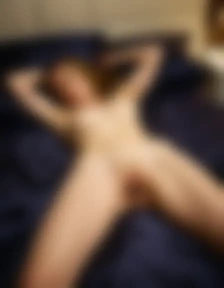 Zoe in a contemporary bedroom at night, disheveled bed, nightstand.