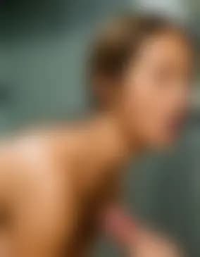 Leah gives a blowjob in the basement laundry room.