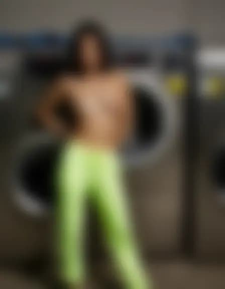 Chloe in an industrial laundry room; harsh lighting, washing machines.