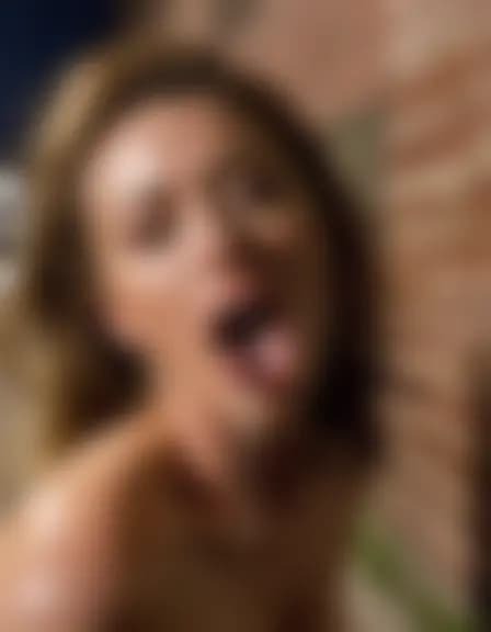 Olivia receives a facial cumshot in a dark alleyway.