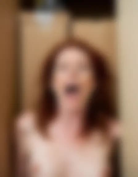 Evelyn, in a cramped closet with boxes, reaches orgasm.