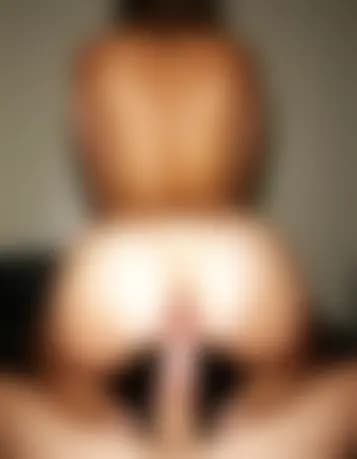 Zoe in a sensual cowgirl position, serene massage room.