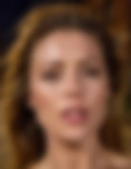 Olivia receives a facial cumshot in a dark alleyway.